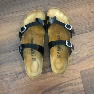 Birkenstock - black metallic straps.